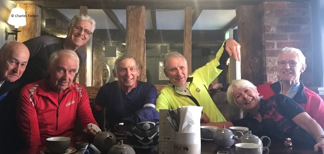 Photo of seven cyclists at the coffee stop